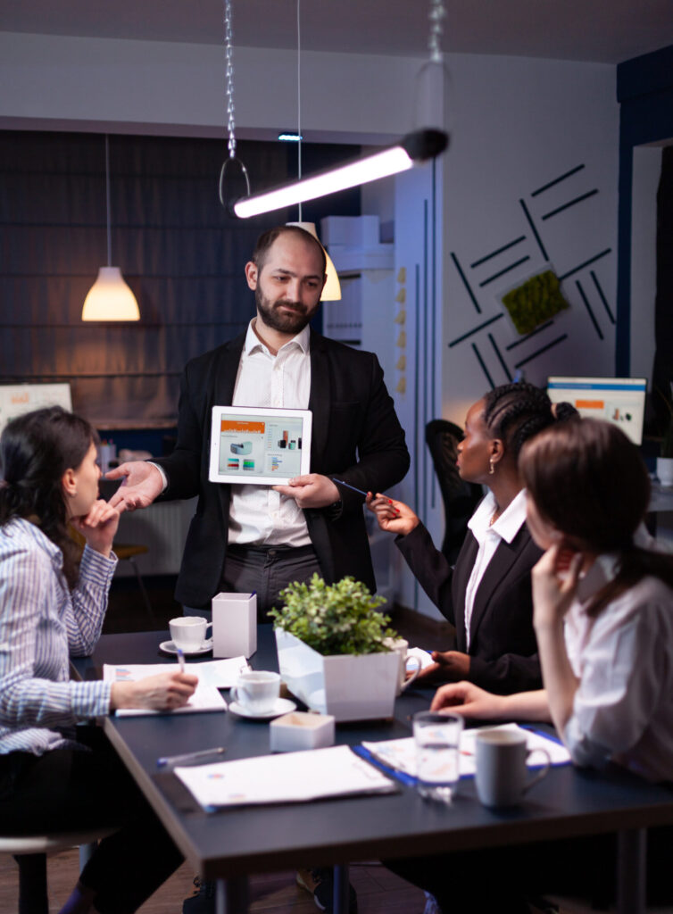 business entrepreneur man presenting company statistics using tablet for financial presentation