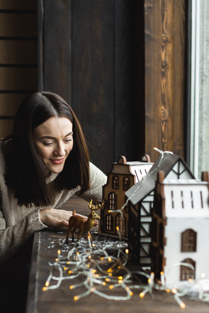 mother arranging christmas toys
